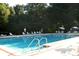 Community pool area with plenty of seating for relaxation and recreation at 11091 Sw 76Th Ter, Ocala, FL 34476