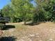 Spacious backyard featuring a mix of trees and shaded areas, offering privacy at 11445 Sw 84Th Avenue Rd, Ocala, FL 34481
