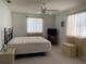 Bright bedroom with two windows, ceiling fan and a comfortable bed, perfect for relaxation and rest at 11445 Sw 84Th Avenue Rd, Ocala, FL 34481