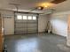Open two-car garage with an electric door, great for storage and convenience at 11445 Sw 84Th Avenue Rd, Ocala, FL 34481