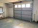 Empty garage with shelves and plenty of room for cars, work area or storage at 11445 Sw 84Th Avenue Rd, Ocala, FL 34481