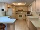 Functional kitchen with tiled floor, ample cabinet space, and standard appliances at 11445 Sw 84Th Avenue Rd, Ocala, FL 34481