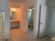 Open area connecting main bedroom to ensuite bath and vanity area at 11445 Sw 84Th Avenue Rd, Ocala, FL 34481