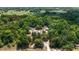 Expansive wooded lot featuring home and outbuildings on a tree-lined property with secluded privacy at 11447 Sw 128Th Ave, Dunnellon, FL 34432