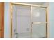 Close-up of a clean, bright shower/tub with glass doors and white tiling at 11447 Sw 128Th Ave, Dunnellon, FL 34432