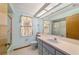 Bathroom features a vanity with sink, toilet, and a shower/tub combo at 11447 Sw 128Th Ave, Dunnellon, FL 34432