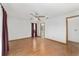 Bright bedroom features wood floors and a neutral color scheme for a relaxing atmosphere at 11447 Sw 128Th Ave, Dunnellon, FL 34432