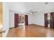 Spacious bedroom features wood flooring, large windows, and a sliding glass door to the outside at 11447 Sw 128Th Ave, Dunnellon, FL 34432
