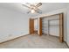 Bedroom with a closet, ceiling fan, and a doorway leading to another room at 11447 Sw 128Th Ave, Dunnellon, FL 34432