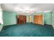 Large bonus room with green carpet and a ceiling fan at 11447 Sw 128Th Ave, Dunnellon, FL 34432