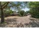 Home nestled in serene natural surroundings with a rustic wooden fence enclosing the property at 11447 Sw 128Th Ave, Dunnellon, FL 34432