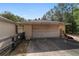 Two car garage, adjacent to the home and accessed via a long driveway at 11447 Sw 128Th Ave, Dunnellon, FL 34432