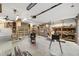 Large garage interior with roll up door, shelving and plenty of space for projects at 11447 Sw 128Th Ave, Dunnellon, FL 34432