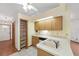 Well-organized kitchen features ample cabinet space and a large pantry for storage at 11447 Sw 128Th Ave, Dunnellon, FL 34432