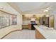 Bright kitchen features stainless steel appliances, gas range, and a breakfast bar at 11447 Sw 128Th Ave, Dunnellon, FL 34432