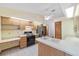 Kitchen with a gas range, stainless steel refrigerator, and breakfast bar at 11447 Sw 128Th Ave, Dunnellon, FL 34432