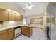 Bright kitchen boasts stainless steel appliances, lots of counter space, and convenient breakfast bar seating at 11447 Sw 128Th Ave, Dunnellon, FL 34432
