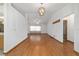Inviting living room with hardwood floors, bright walls, and view to the kitchen at 11447 Sw 128Th Ave, Dunnellon, FL 34432