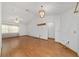 Spacious living room with wood floors, modern light fixtures, and vaulted ceiling at 11447 Sw 128Th Ave, Dunnellon, FL 34432