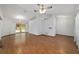 Bright and spacious living room with wood floors, ceiling fan, and ample natural light at 11447 Sw 128Th Ave, Dunnellon, FL 34432
