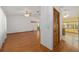 Bright living room with hardwood floors, ceiling fan, and an open floor plan at 11447 Sw 128Th Ave, Dunnellon, FL 34432