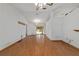 Large living room featuring wood floors and sliding glass doors to the backyard at 11447 Sw 128Th Ave, Dunnellon, FL 34432