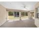 Screened patio with a ceiling fan, offering an outdoor living space at 11447 Sw 128Th Ave, Dunnellon, FL 34432