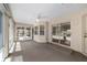 The screened patio has ceiling fan and sliding glass doors leading outdoors at 11447 Sw 128Th Ave, Dunnellon, FL 34432