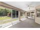 The screened patio offers natural light and view of the outdoor space at 11447 Sw 128Th Ave, Dunnellon, FL 34432