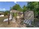 Two sheds with varying doors and ramps, with a charming tree stump feature and vibrant greenery at 11447 Sw 128Th Ave, Dunnellon, FL 34432