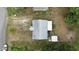 Aerial view of property featuring house, backyard, shed, and surrounding greenery, providing a bird's eye perspective at 116 Nw 17Th Pl, Ocala, FL 34475