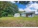 View of backyard featuring shed, and ample green space, and a view of the property line at 116 Nw 17Th Pl, Ocala, FL 34475
