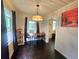 Charming dining room with chandelier lighting and hardwood floors, perfect for Gathering meals at 116 Nw 17Th Pl, Ocala, FL 34475