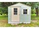 Backyard shed featuring a single door, small side window, and weather-resistant build at 116 Nw 17Th Pl, Ocala, FL 34475