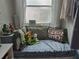 Cozy window nook in bathroom featuring cushioned bench and fun decor at 11651 Sw 77Th Cir, Ocala, FL 34476