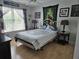 Cozy bedroom with light hardwood floors, ceiling fan and Star Wars decor at 11651 Sw 77Th Cir, Ocala, FL 34476