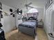 Spacious bedroom featuring Star Wars decor, hardwood floors, and a ceiling fan at 11651 Sw 77Th Cir, Ocala, FL 34476