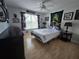 Cozy bedroom with light hardwood floors, ceiling fan and Star Wars decor at 11651 Sw 77Th Cir, Ocala, FL 34476