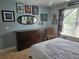 Bedroom with a dark dresser, Star Wars decor and bright, natural light at 11651 Sw 77Th Cir, Ocala, FL 34476