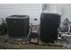 Image shows HVAC unit and water heater on a bed of rocks next to the home at 11651 Sw 77Th Cir, Ocala, FL 34476