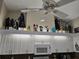 The kitchen features white cabinets with display of Star Wars and Disney figurines at 11651 Sw 77Th Cir, Ocala, FL 34476