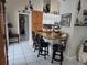 Kitchen with breakfast bar and black bar stools at 11651 Sw 77Th Cir, Ocala, FL 34476