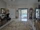 Living room showing a view of the screened-in pool at 11651 Sw 77Th Cir, Ocala, FL 34476