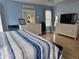 Bright bedroom with light blue walls and plenty of natural light at 11651 Sw 77Th Cir, Ocala, FL 34476