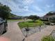 Neighborhood street view showing manicured lawns, mature trees, and well-maintained homes at 11651 Sw 77Th Cir, Ocala, FL 34476