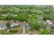 Overhead view of the house showing the backyard shed and surrounding trees at 13102 Se 101St Ave, Belleview, FL 34420