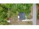 Aerial top-down view of the house and shed surrounded by many trees at 13102 Se 101St Ave, Belleview, FL 34420
