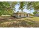 View of the backyard with a chainlink fence and a view of the back of the house at 13102 Se 101St Ave, Belleview, FL 34420