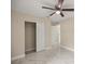 Bedroom with marble tile floors, ceiling fan, and closet at 13102 Se 101St Ave, Belleview, FL 34420