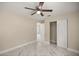 Bedroom with marble tile floors, closet, and entry to bathroom at 13102 Se 101St Ave, Belleview, FL 34420